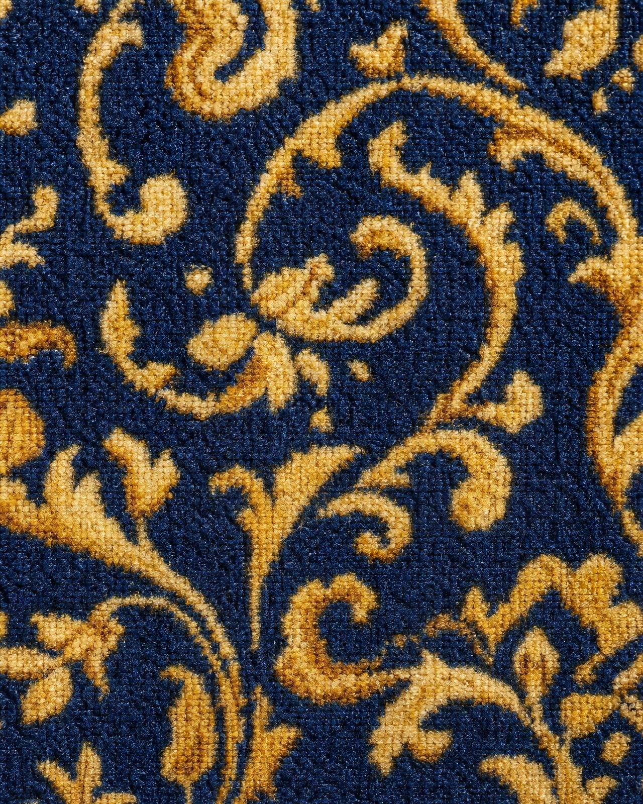 Macro of navy and gold Axminster contract carpet pattern