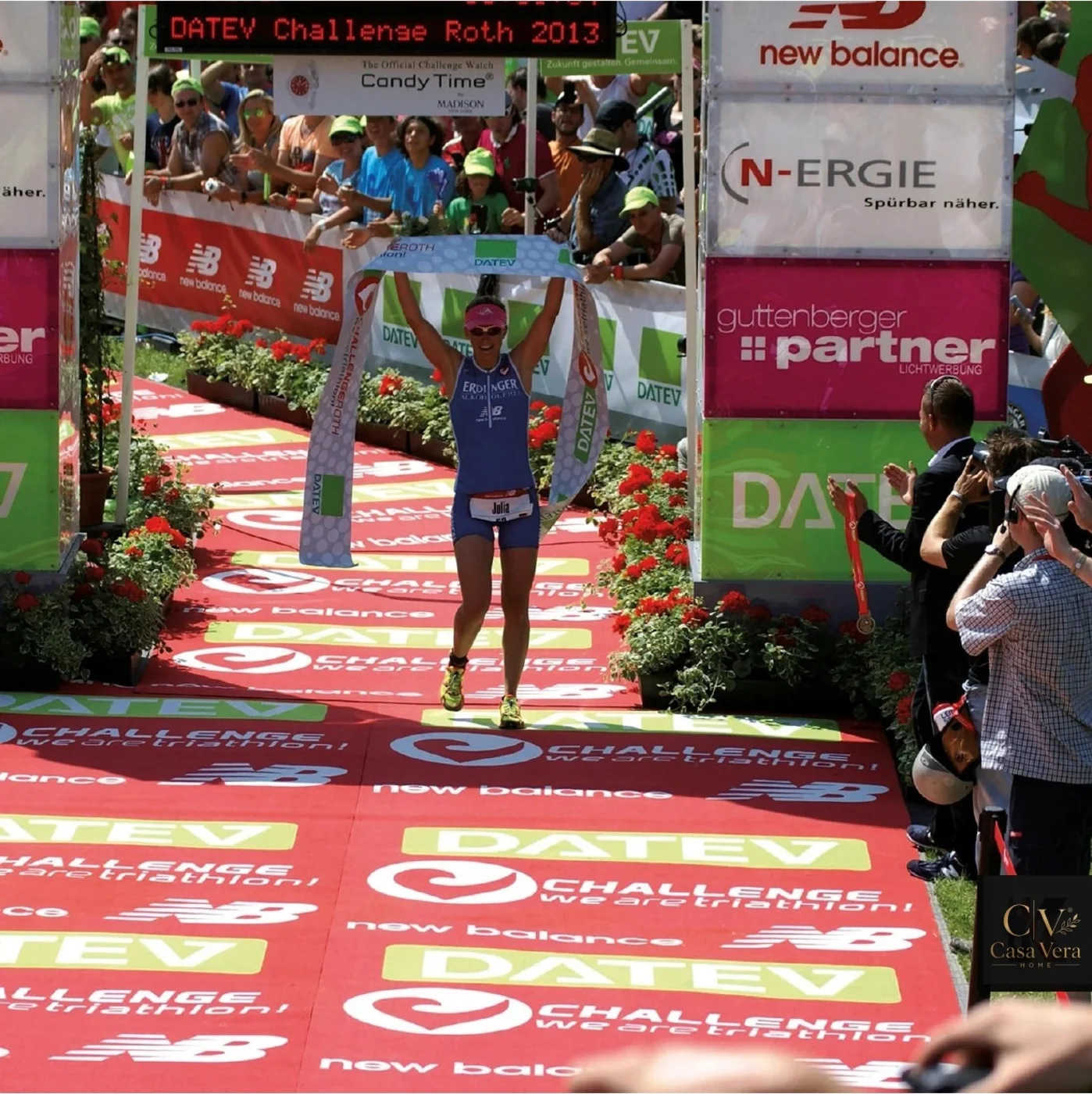 Long red large-format printed mat laid as a finishing straight at a sporting event