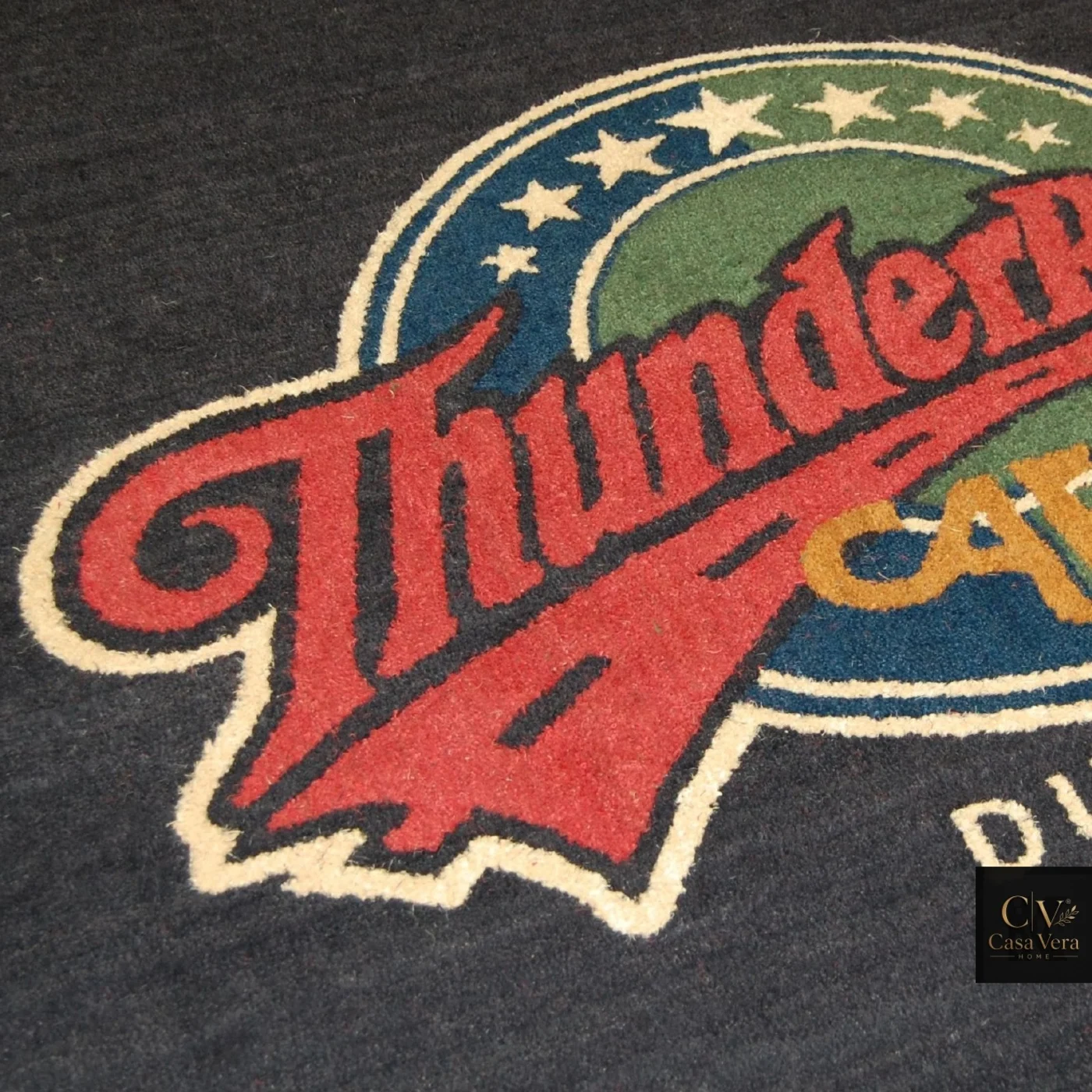 Close view of a multi-colour emblem inlaid into a coir logo mat