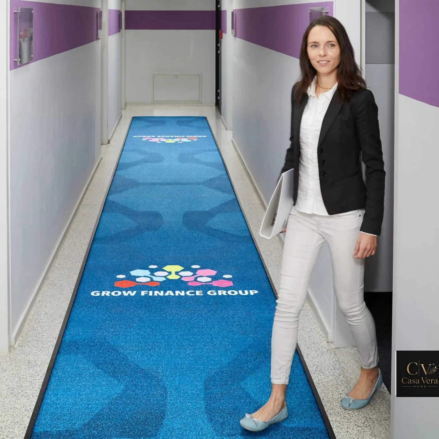 Long blue printed Horizon runner mat laid down a corporate corridor