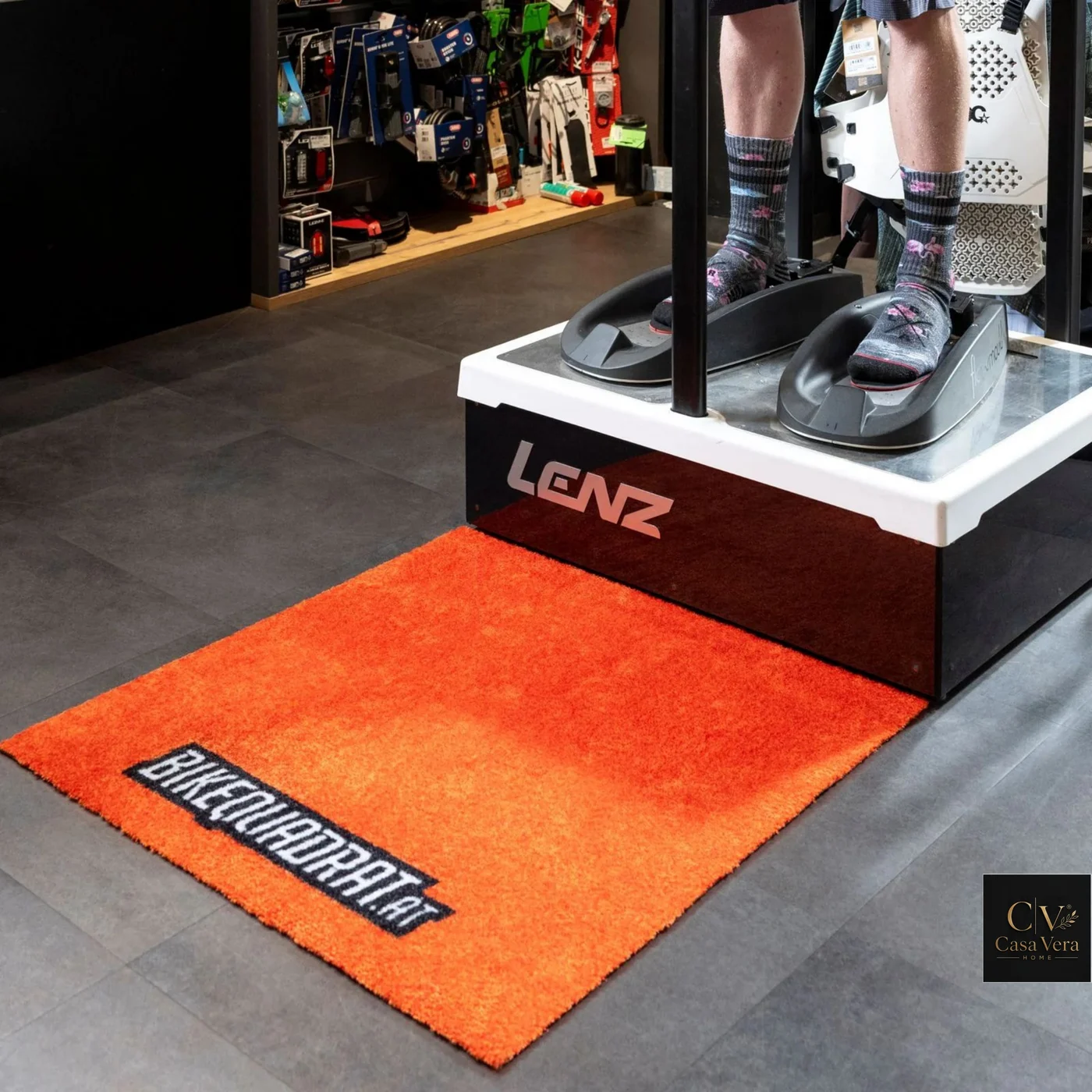 Orange printed Jet Luma mat beneath a retail display platform